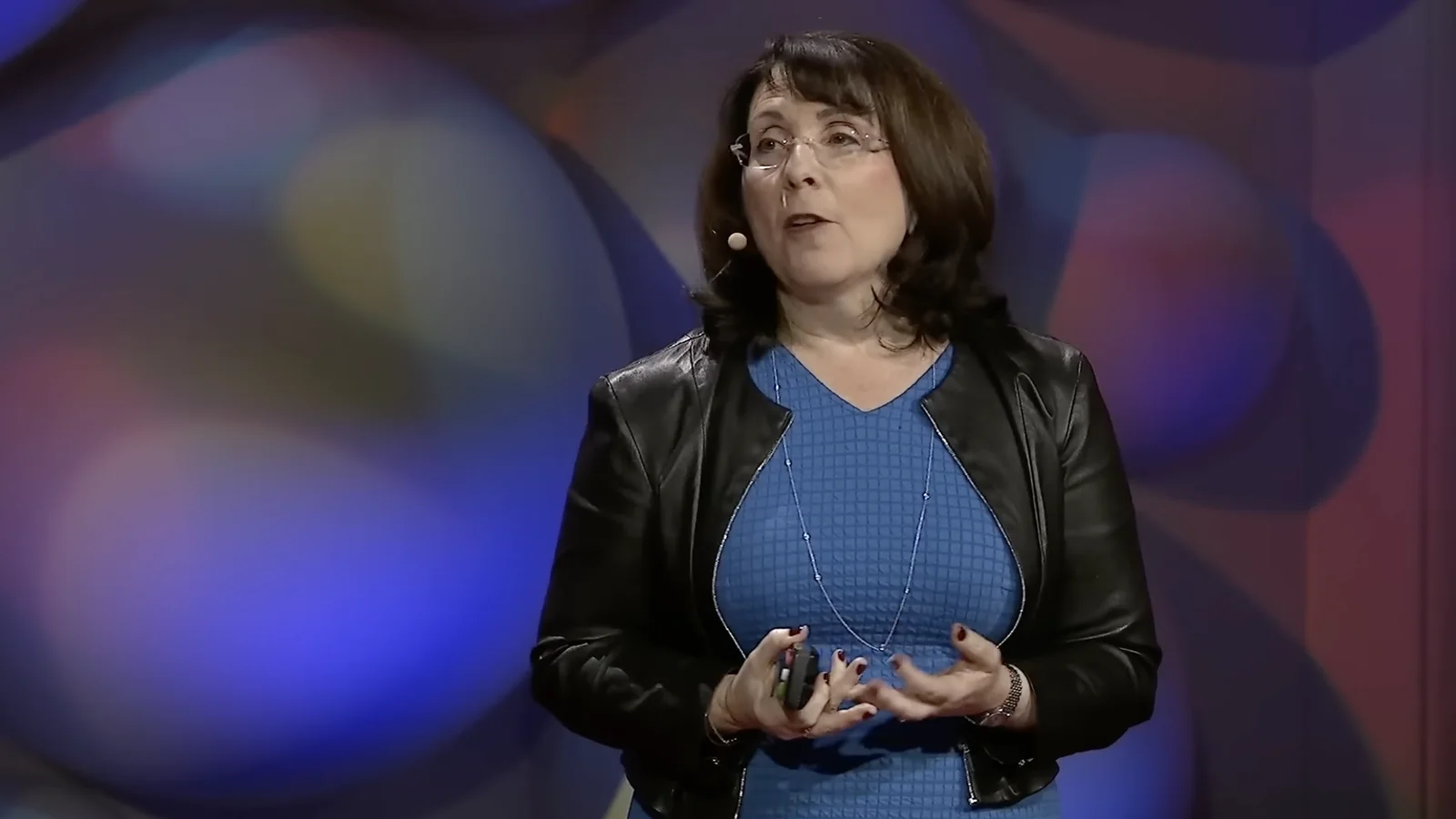 Lisa Feldman Barrett speaking on stage about how emotions are made
