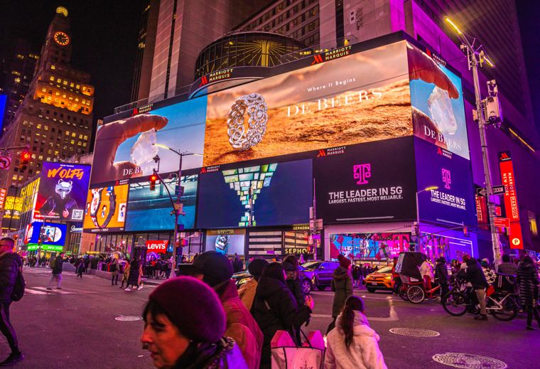 De Beers billboards lit up in Times Square at night